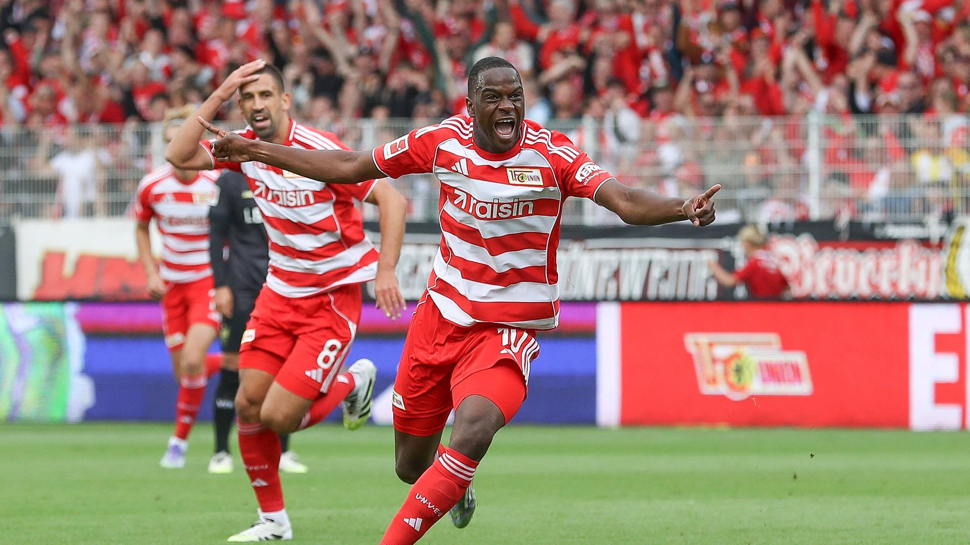 Unions Ansah jubelt über seinen Treffer zum 1:0 gegen Stuttgart (r.) | IMAGO/Jan Huebner