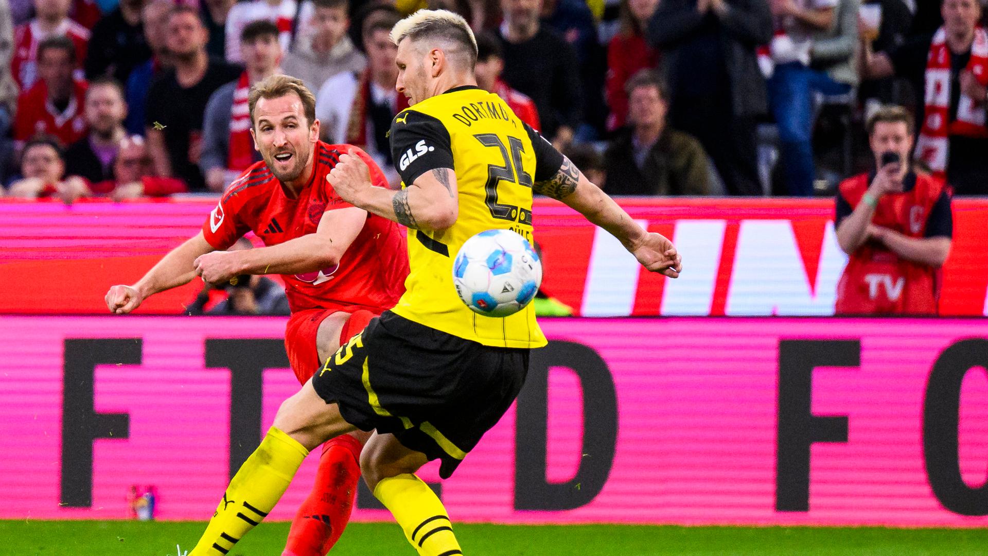Bayerns Harry Kane (l.) und Dortmunds Nico Schlotterbeck | dpa/Tom Weller