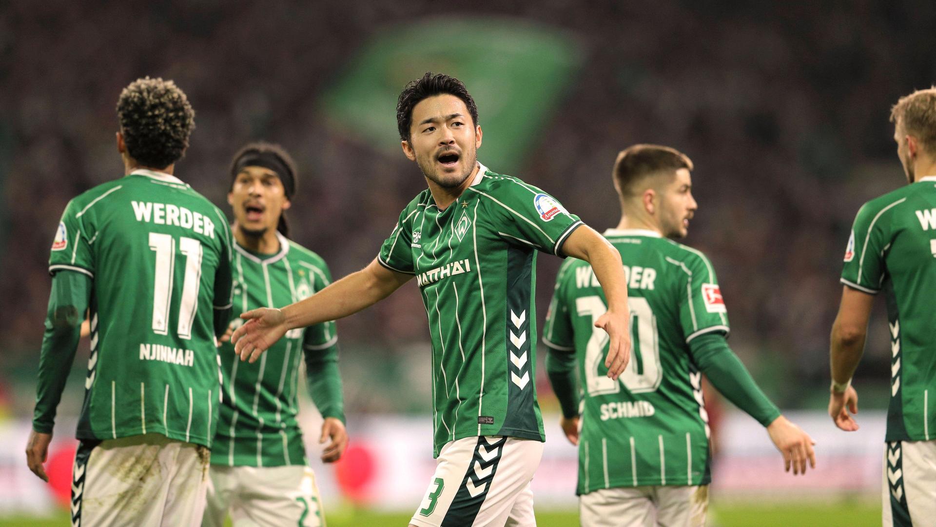 Werders Sugaware reißt den Mund auf und breitet die Arme aus. | Imago | Claus Bergmann