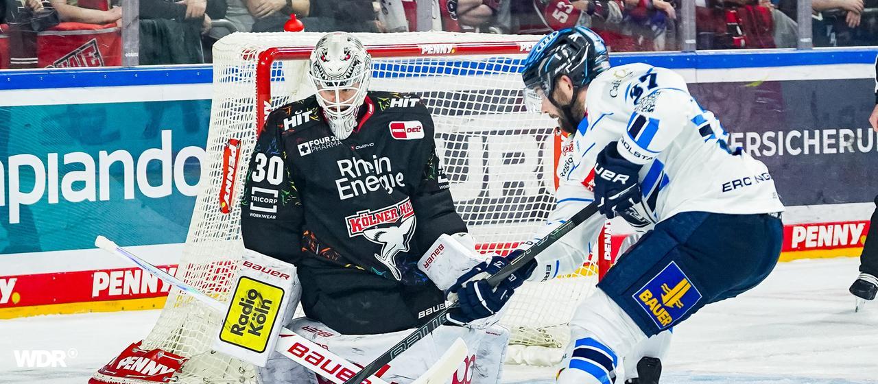 Haie-Keeper Janne Juvonen im Duell mit Riley Barber.